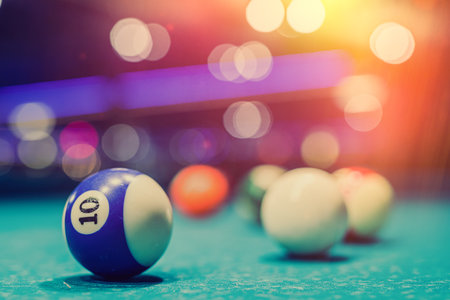 The billiards sports club invites everyone to ride layers at spacious tables with sticks. adult games conceptの写真素材