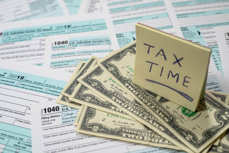 us dollars above on tax forms 1040. Financial concept. tax time.の写真素材