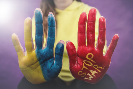 female hand paint in red no stop war as slogan of peace at all world. The concept of peace No warの写真素材