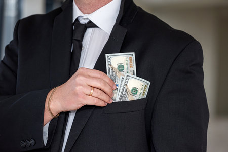 us dollar in businessman hands, saving conceptの写真素材