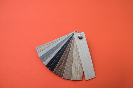 Wooden parquet floor sample interior material isolated on orange background. copy spaceの写真素材