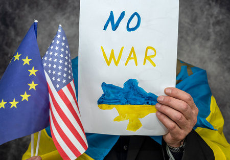 patriot of ukraine stands with inscriptions Stop Putin, Stop the War Stop Fascism and the Murder of Ukrainian Children. The concept of support for Ukraine from European countriesの写真素材