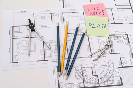 work tools with memo heen help on house plan blueprint. construction drawing projectの写真素材