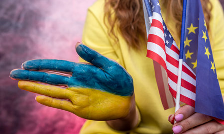 female hand painted in national blue yellow flag of Ukraine. patriotの写真素材