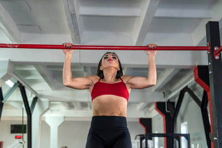 Young muscular caucasian woman doing exercise workout at the gym. bodybuilding. sport for health
