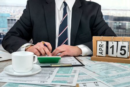 businessman working with documents 1040 tax form in office. Concept of accounting financial annual reportの写真素材
