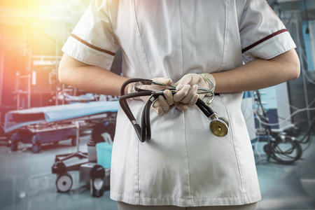 Portrait of female nurse wear white uniform and stethoscope in operation room in hospital. medical conceptの写真素材