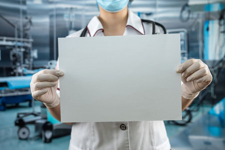 female doctor in white coat uniform showing empty clipboard to write for record patient diagnosis in modern room clinicの写真素材