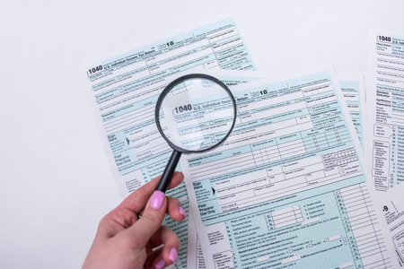 tax forms are not carefully arranged in the workplace in the office. The concept of tax formsの写真素材