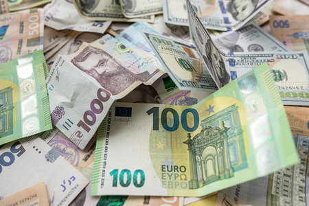 set of hryvnia dollar and euro banknotes as business background. Money saving concept. Exchange...