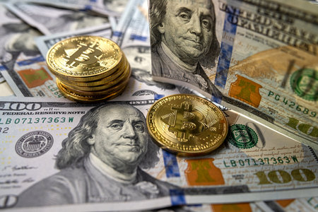 Bitcoin growth and investment coin isolated on US dollar bills .Bitcoin coin and cash background...