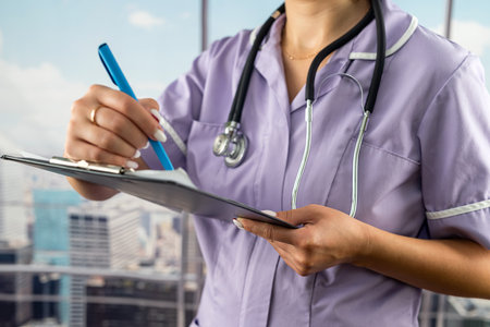 cropped portrait of young nurse taking notes on patient's illness in hospital. doctor doctor's recordsの写真素材