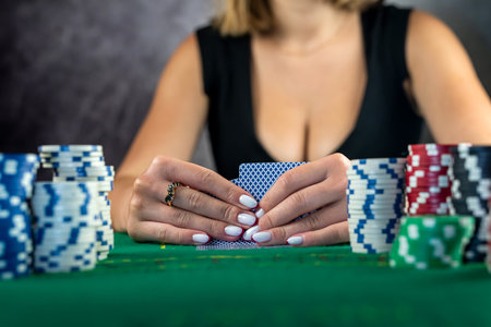 Young woman taking money from her wallet betting everything in a risky game of poker. raising the...