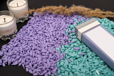 wax cartridges with different colors for epilation top view. Concept of cosmetology and beauty. The concept of depilation and beauty. sugar paste or wax for hair removal.の写真素材