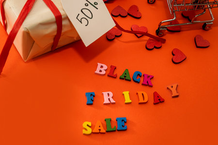 inscription in colored letters black friday gifts and discount label isolated on plain background. Black friday conceptの写真素材