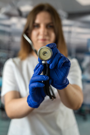 doctor or nurse in uniform with stethoscope standing in emergency room. health care and medicine. doctorsの写真素材