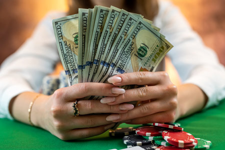 player counts chips for money and raises while playing casino poker. gambling concept. woman and...