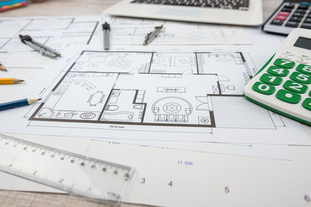 Technological drawings of buildings on large white sheets of paper. Part of the engineering project.