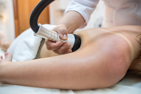 professional massage therapist woman makes a relaxing massage for a good client. spa treatments. the best salonの写真素材
