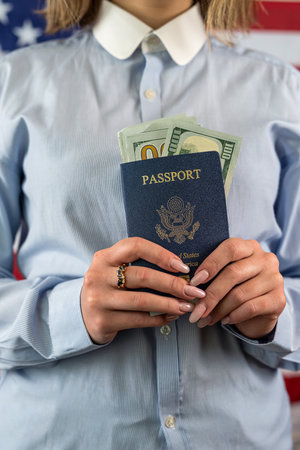 beautiful young conductor checks an American's passport before entering another country. the concept of checking passports before the borderの写真素材