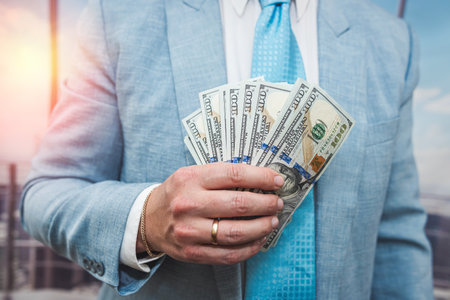 young man in a suit counts the money, finance concept. close upの写真素材