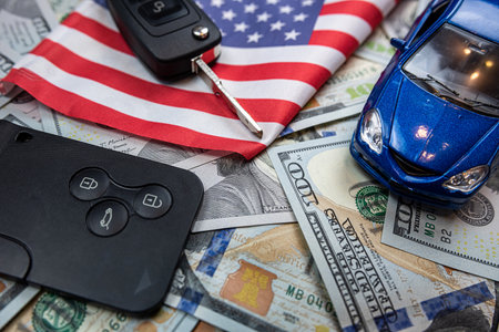 Car's keys on the dollar money and usa flag, finance purchase sale insurance concept