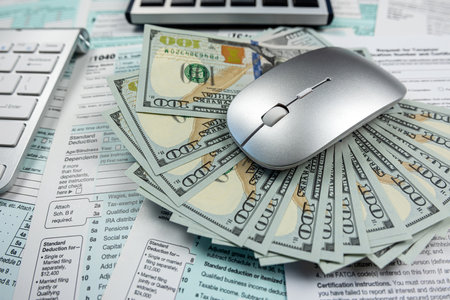 blank tax return form 1040 with dollar banknote. Deadline business finance concept