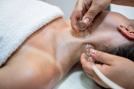 best masseur with gentle hands massage head and face for best client with beautiful face. Relaxing massage conceptの写真素材