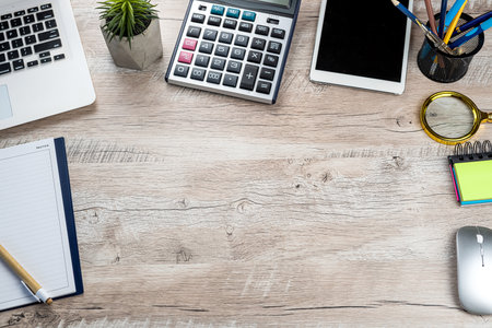 top view of laptop, notebook pen caluclator flower on office desk with. Distance office workplaceの写真素材