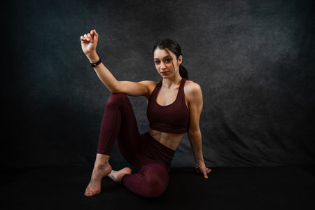 portrait of cheerful fitness woman in sport cloth bra isolated on black. Healthy lifestyle