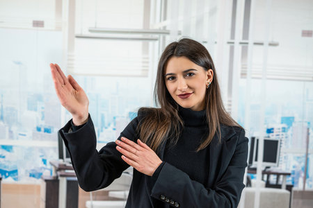 Portrait of alone caucasian business woman manager in office hall. Workplace