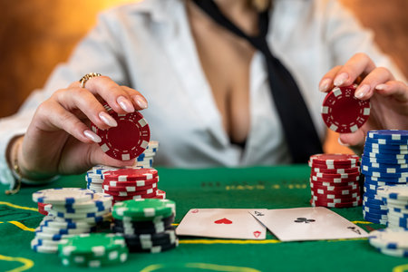 girl in poker has won everything and takes all the chips with her own hands. Playing casino or poker. focus on the chips. Raising rates or gambling business. isolatedの写真素材