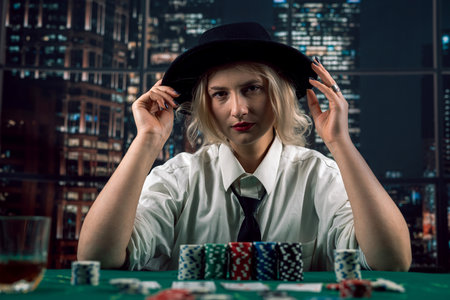 young girl player came to the casino to play poker with cards and chips. poker. casino. female handsの写真素材