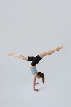 Slim caucasian woman wear sport cloth doing relaxation yoga exercise practice balance asanas...