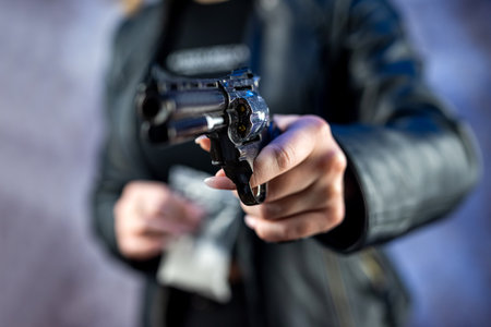 illegal concept crime woman hold bag with addict narcotics cocaine powder and gun. Danger addiction...
