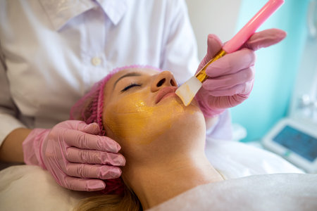 A young girl in a medical spa came for chemical peeling of the body and cosmetic treatment of acne. beauty salon. the concept of cosmetology procedures. self loveの写真素材