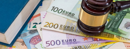 hammer gavel on euro banknotes on rusty table. Judge legal conceptの写真素材