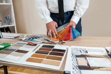 young designer work with blueprint and sketch house and color palette at office. Creative workspaceの写真素材