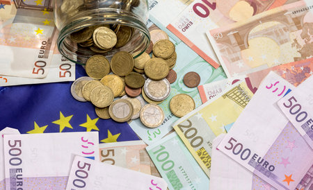 pile of Euro paper with metal coins, close up. EU economy and finance conceptの写真素材