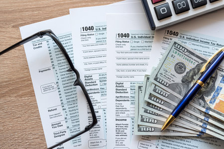 2023 tax form 1040 us  money and glasses, taxation concept. Time for tax, financeの写真素材