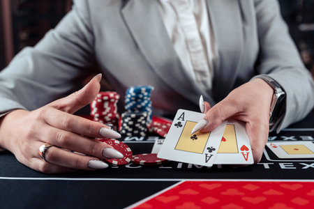 female player shows winning combination of two aces, win in casino poker. Gambling conceptの写真素材