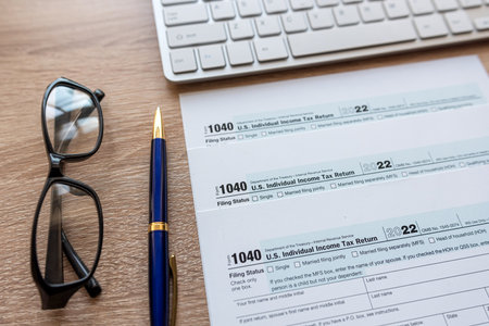 Top view of office desktop wit hfinance document tax form pen keyboard, taxation conceptの写真素材