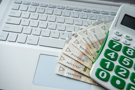 Finance background pln zloty money with empty notepad calculator and laptop, Saving conceptの写真素材