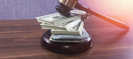 Wooden judge gavel with us usd dollars paper money. Auction bidding conceptの写真素材
