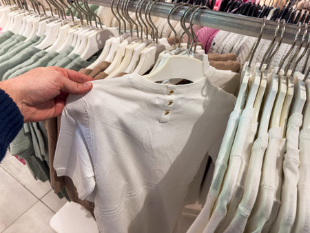 close up woman choose blouse and shopping in boutiqe. Concept of shopping and clothes with fashionの写真素材