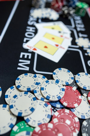 Black casino table with card and chips for game. Win and fortune. Gambling