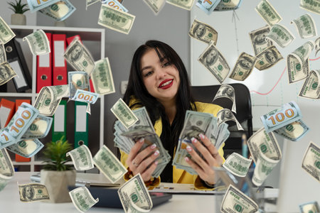 Attractive young european woman and rain of dollar cash as operation of money and currency. A lottery or sweepstakes jackpot winnerの写真素材