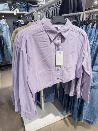New collection women's clothing on hangers in a boutique. Fashion show room in shopping mall