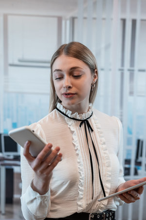 Young businesswoman use smart phone at office, Lunch Breakの写真素材