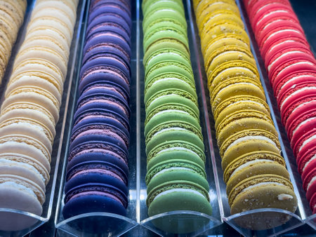 French fresh tasty colorful macarons in a row places in the showcase in shop. Traditional food for breakfastの写真素材